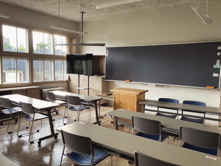Bright, tidy classroom in Asahikawa, Hokkaido with natural light and modern furnishings.